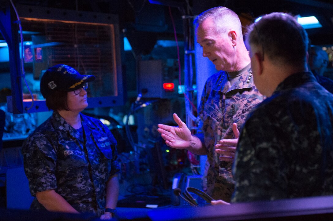 Marine Corps Gen. Joe Dunford, chairman of the Joint Chiefs of Staff, speaks with Navy Cmdr. Jennifer Eaton, commanding officer of the Arleigh Burke-class guided missile destroyer USS Barry, in Yokosuka, Japan, Sept. 07, 2016, in Japan. DoD photo by Army Sgt. James K. McCann