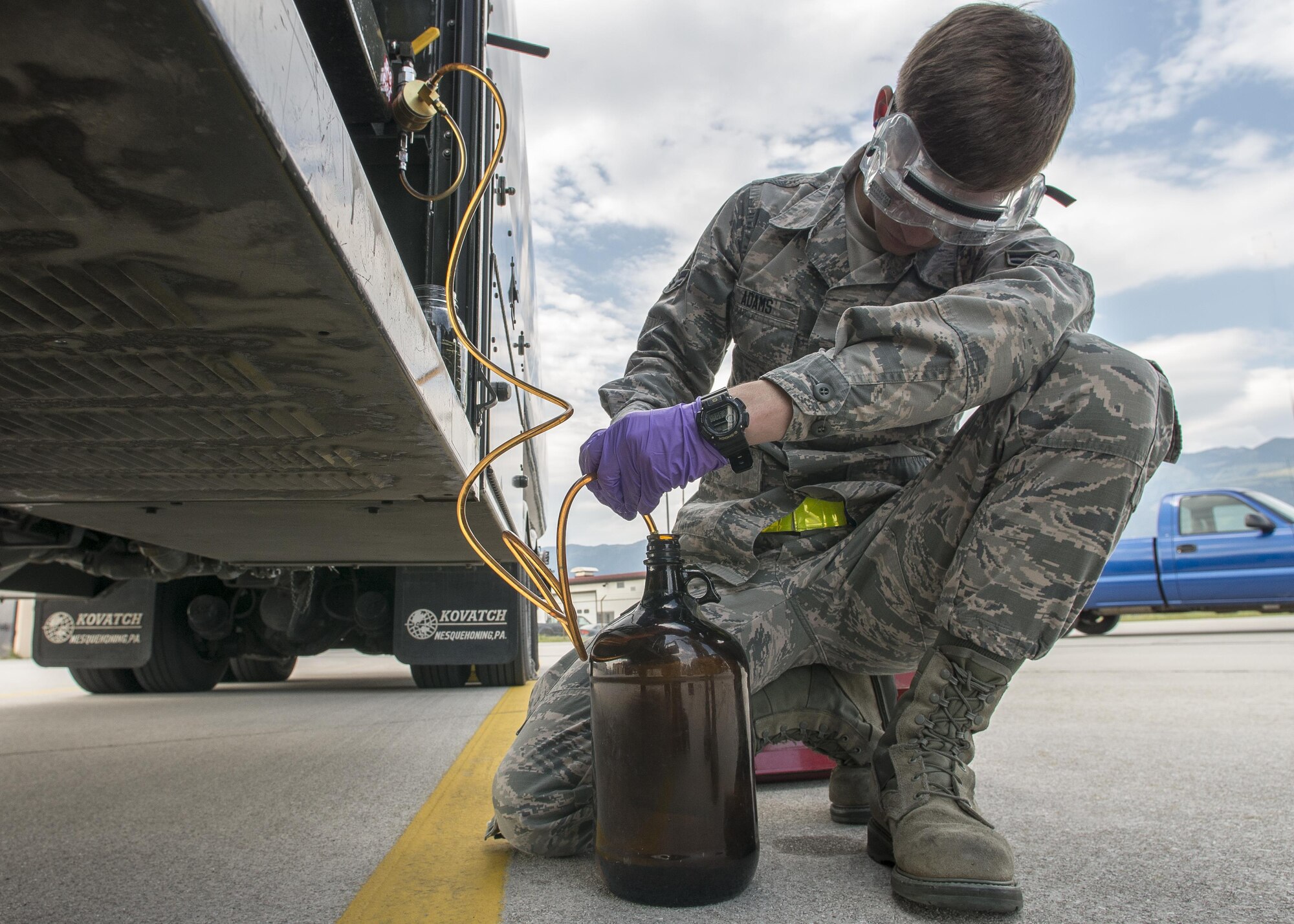 Airman 1st Class Chandler Adams, 31st Logistics Readiness Squadron fuels laboratory technician, collects and tests a fuel sample from a fuels truck at Aviano Air Base, Italy, Sept. 7, 2016. Before fuel is pumped into an aircraft, it’s tested by 31st LRS fuels laboratory Airmen to ensure it’s free of contaminants that could negatively affect the aircraft. (U.S. Air Force photo by Airman 1st Class Cory W. Bush/Released)