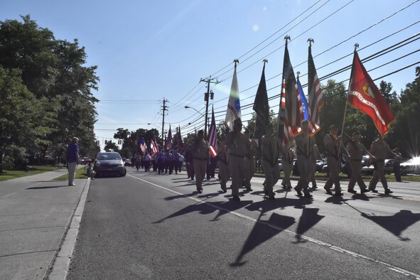 Pfc. George H. Traver was killed in action on Nov. 20, 1943. His body was one of many found earlier this year in the Gilbert Islands, just off the coast of Hawaii. Hundreds of citizens, many with no relation to Traver, came out to celebrate the return of his remains during a processional to and from a funeral service held in his honor at the St. James Catholic church in his hometown of Chatham, New York.   (U.S. Air Force photo/ TSgt. Amelia Leonard)