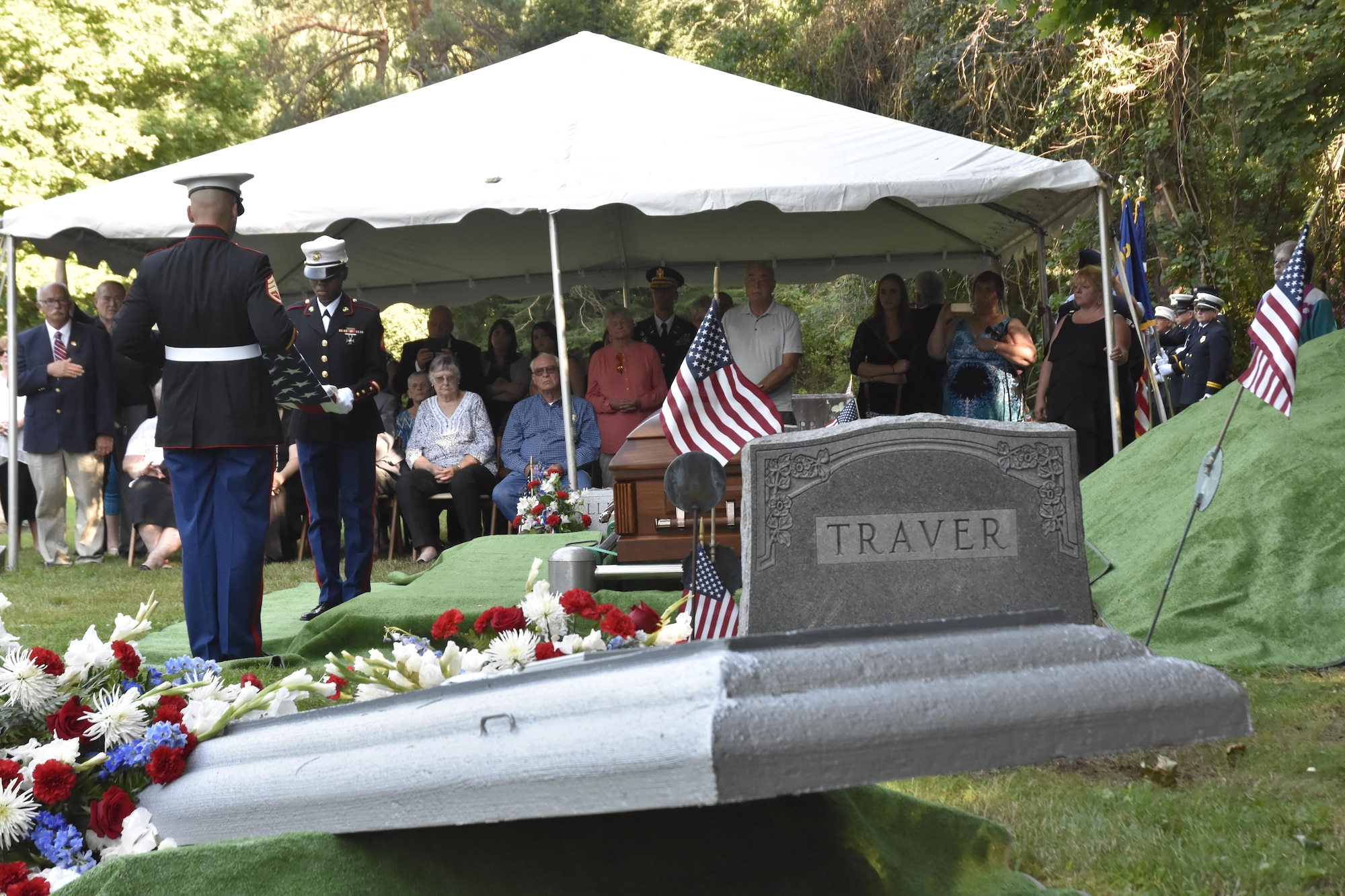 Pfc. George H. Traver was killed in action on Nov. 20, 1943. His body was one of many found earlier this year in the Gilbert Islands, just off the coast of Hawaii. The Marine Air Support Squadron 6 from Westover ARB, Mass. presided over the formal military funeral ceremony and presented his nephew, David Silliman, with a United States flag in his honor. (U.S. Air Force photo/ TSgt. Amelia Leonard)