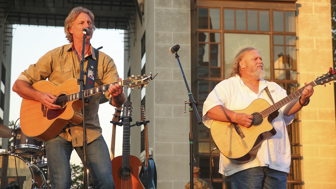 Darryl Worley, left, a country music artist, performs for Marines and Nashville, Tenn. residents during the opening ceremony of Marine Week Nashville, Sept. 7, 2016. Marine Week is an opportunity to commemorate the unwavering support of the American people, and show the Marine Corps’ dedication to protecting citizens of this country.