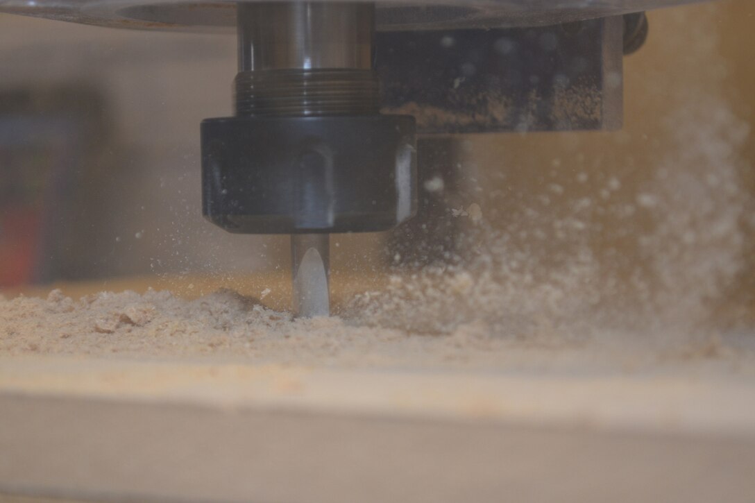 The precision 3-Dimensional CNC Router cuts through wood inside SERMC's Fabrication Laboratory, or Fab Lab. DARPA, who supplied the Fab Lab, designed it so Sailors at SERMC will convert innovative ideas into designes and rapid prototypes which could be used fleet-wide. 