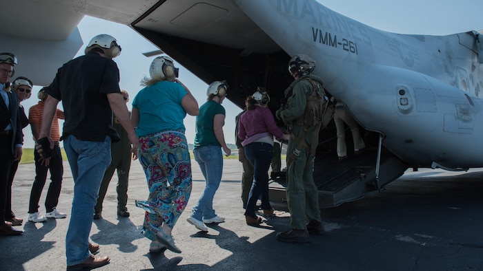 Local dignitaries make their way on to the MV-22B Osprey before a public flyover of Nashville as part of Marine Week, Sept. 7, 2016. Marine Week Nashville is a chance to reconnect with out Marines, sailors, veterans and their families form different generations.