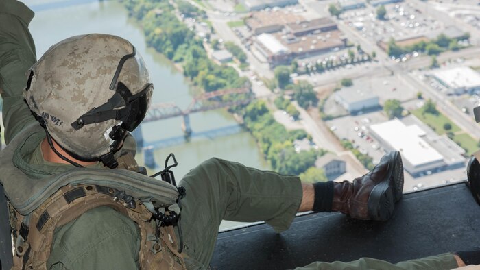 Cpl. Joshua Haynes a crewmember with Marine Medium Tiltrotor Squadron 261 supervises the passengers during the MV-22B Osprey flights over Nashville, Tenn., Sept. 7, 2016 as part of Marine Week.  Marine Week provides an opportunity for the Marine Corps to visit cities that normally don’t have the opportunity to interact with Marines on a regular basis.