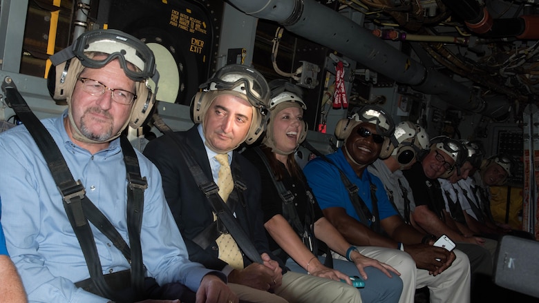 Local dignitaries from Nashville, Tenn., enjoy their military experience with the crew of Marine Medium Tiltrotor Squadron 261 during the MV-22B Osprey flights over Nashville as part of Marine Week. Marine Week Nashville is an opportunity to showcase the Marines and help people understand the capabilities of the Marine Corps.