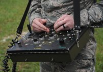 Senior Airman Brayden Kerr, 2nd Civil Engineer Squadron Explosive Ordnance Disposal Flight team member, uses the operating control unit to pilot the F6A robot at Barksdale Air Force Base, La., Sept. 6, 2016. The OCU controls the robot’s movements and camera, allowing the technicians to safely eliminate threats from a distance. (U.S. Air Force photo/Airman 1st Class Stuart Bright)
