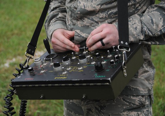Senior Airman Brayden Kerr, 2nd Civil Engineer Squadron Explosive Ordnance Disposal Flight team member, uses the operating control unit to pilot the F6A robot at Barksdale Air Force Base, La., Sept. 6, 2016. The OCU controls the robot’s movements and camera, allowing the technicians to safely eliminate threats from a distance. (U.S. Air Force photo/Airman 1st Class Stuart Bright)