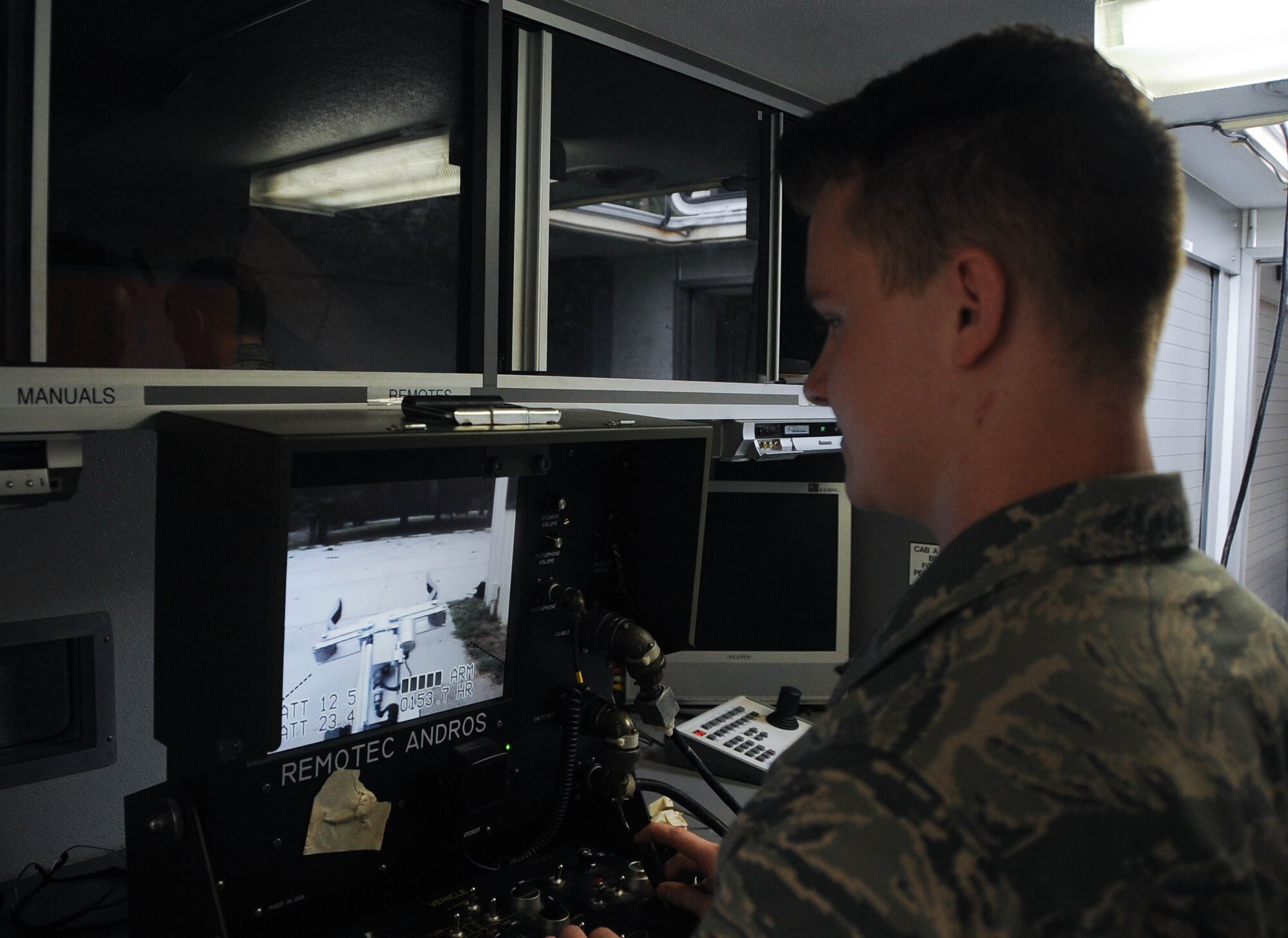 Senior Airman Brayden Kerr, 2nd Civil Engineer Squadron Explosive Ordnance Disposal Flight team member, uses the operating control unit to pilot the F6A robot at Barksdale Air Force Base, La., Sept. 6, 2016. The OCU controls the robot’s movements and camera, allowing the technicians to safely eliminate threats from a distance. (U.S. Air Force photo/Airman 1st Class Stuart Bright)
