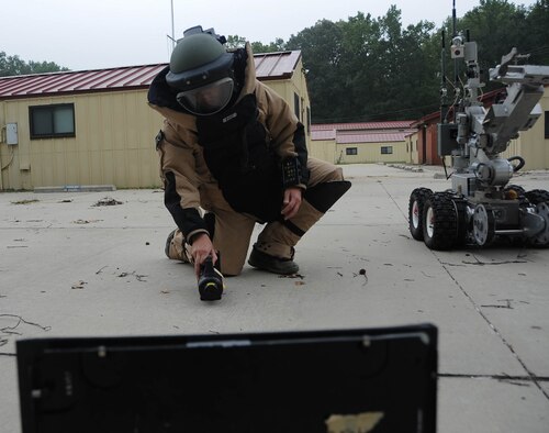 Senior Airman Brayden Kerr, 2nd Civil Engineer Squadron Explosive Ordnance Disposal Flight team member, uses the operating control unit to pilot the F6A robot at Barksdale Air Force Base, La., Sept. 6, 2016. The OCU controls the robot’s movements and camera, allowing the technicians to safely eliminate threats from a distance. (U.S. Air Force photo/Airman 1st Class Stuart Bright)
