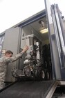 Senior Airman Brayden Kerr, 2nd Civil Engineer Squadron Explosive Ordnance Disposal Flight team member, uses the operating control unit to pilot the F6A robot at Barksdale Air Force Base, La., Sept. 6, 2016. The OCU controls the robot’s movements and camera, allowing the technicians to safely eliminate threats from a distance. (U.S. Air Force photo/Airman 1st Class Stuart Bright)