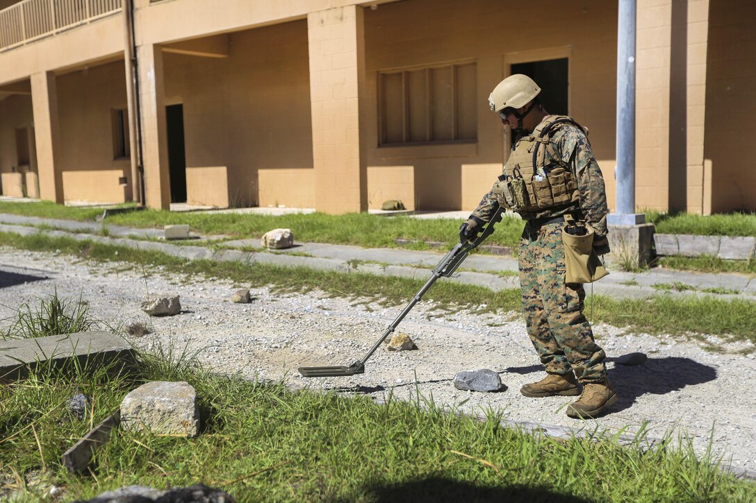 A Marine uses a metal detector as he searches for signs of improvised explosive devices during a counter-IED training exercise at Camp Lejeune, N.C., Sept. 1, 2016. The Marine is an explosive ordnance disposal technician assigned to EOD Company, 8th Engineer Support Battalion. During the exercise, evaluators assessed Marines on their abilities to safely locate and dispose of an IED. Marine Corps photo by Lance Cpl. Aaron K. Fiala