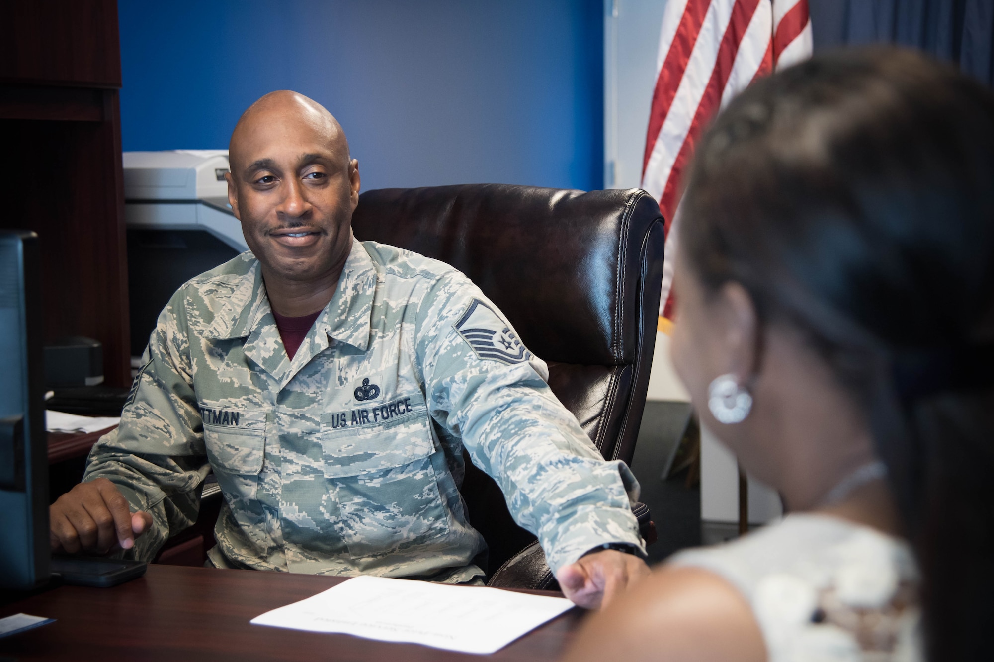 Master Sgt. Patrick Pittman, 403rd Wing recruiter, discusses the opportunities available in the Air Force Reserve Aug. 26 at the D'Iberville, Mississippi recruiting office. (U.S. Air Force photo by Senior Airman Heather Heiney.) 