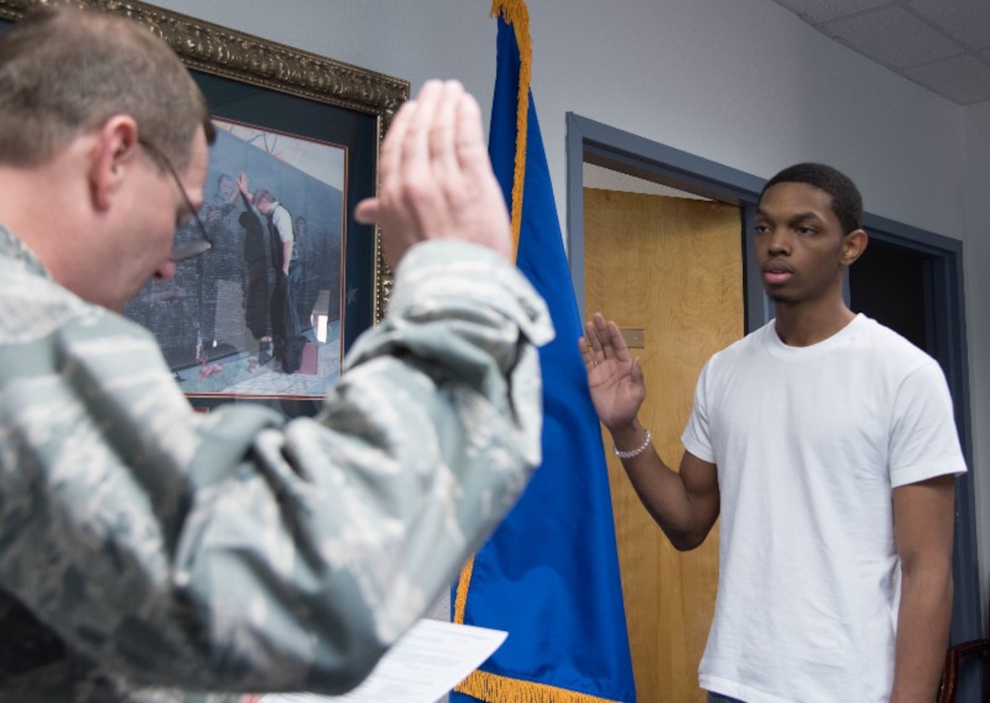 Jaquan Helton, new Air Force Reserve recruit from New Orleans, swears the oath of enlistment at the Air Force Reserve recruiting office on Keesler Air Force Base Aug. 18. (U.S. Air Force photo/Senior Airman Heather Heiney)