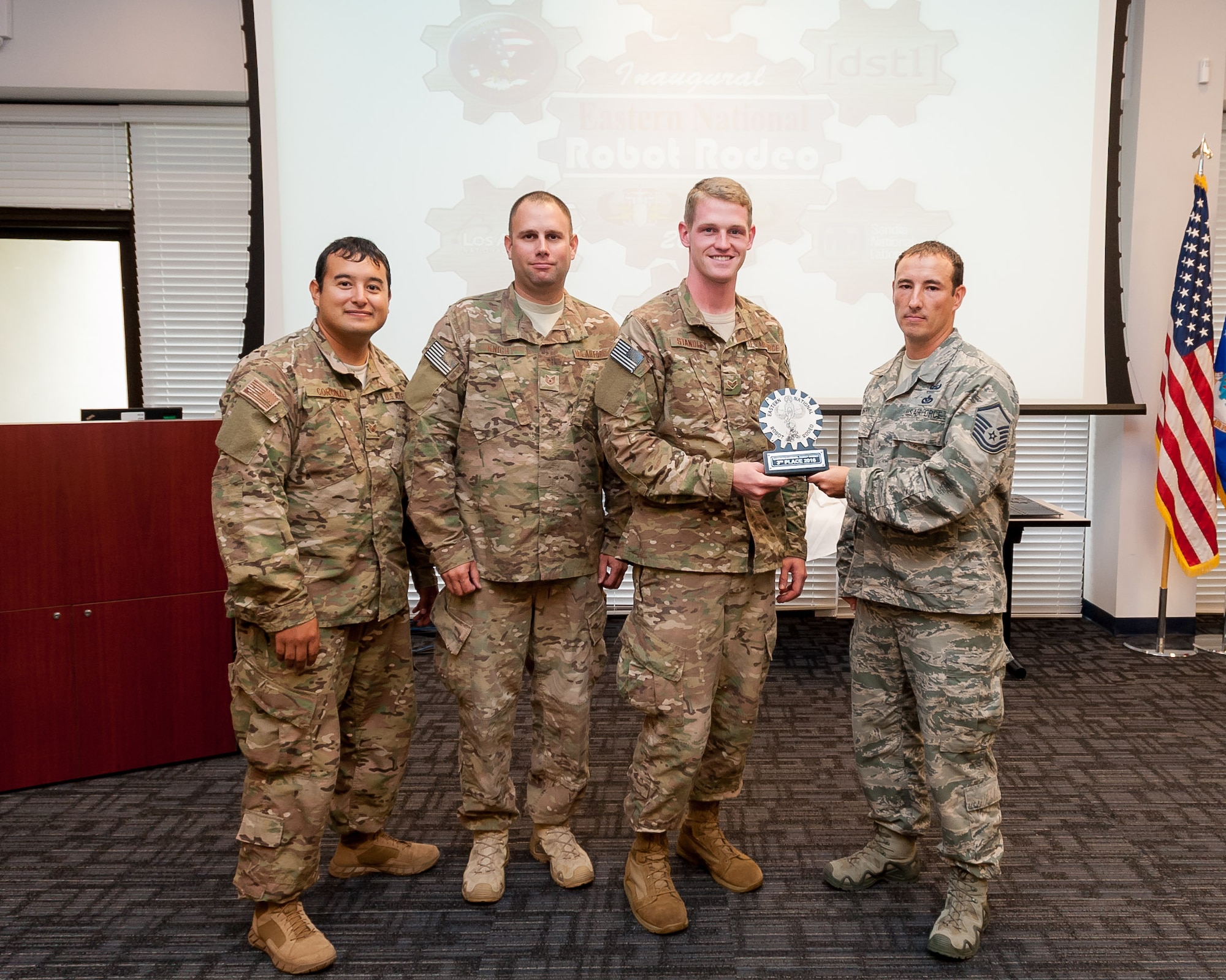 Staff Sgt. Guadalupe Corona, Senior Airman Sean Standley and Tech. Sgt. William Knight, left to right, with the 327th Civil Engineer Squadron's explosive ordnance disposal flight came in third place at the inaugural Eastern Robotics Rodeo & Capability Exercise in Atlanta, Ga, Aug. 29 - Sept. 2, 2016. The event invited military, federal and local EOD to compete using remotely controlled, hazardous-duty robotic platforms to dismantle inert explosive devices in real-world scenarios and provided an opportunity for participants to network and exchange best practices. This year's event was made possible by the partnership of the Air Force Civil Engineer Center, Combating Terrorism Technical Support Office - Technical Support Working Group and the United Kingdom Defense Science and Technology Laboratory. (U.S. Air Force photo by Malcolm McClendon)
