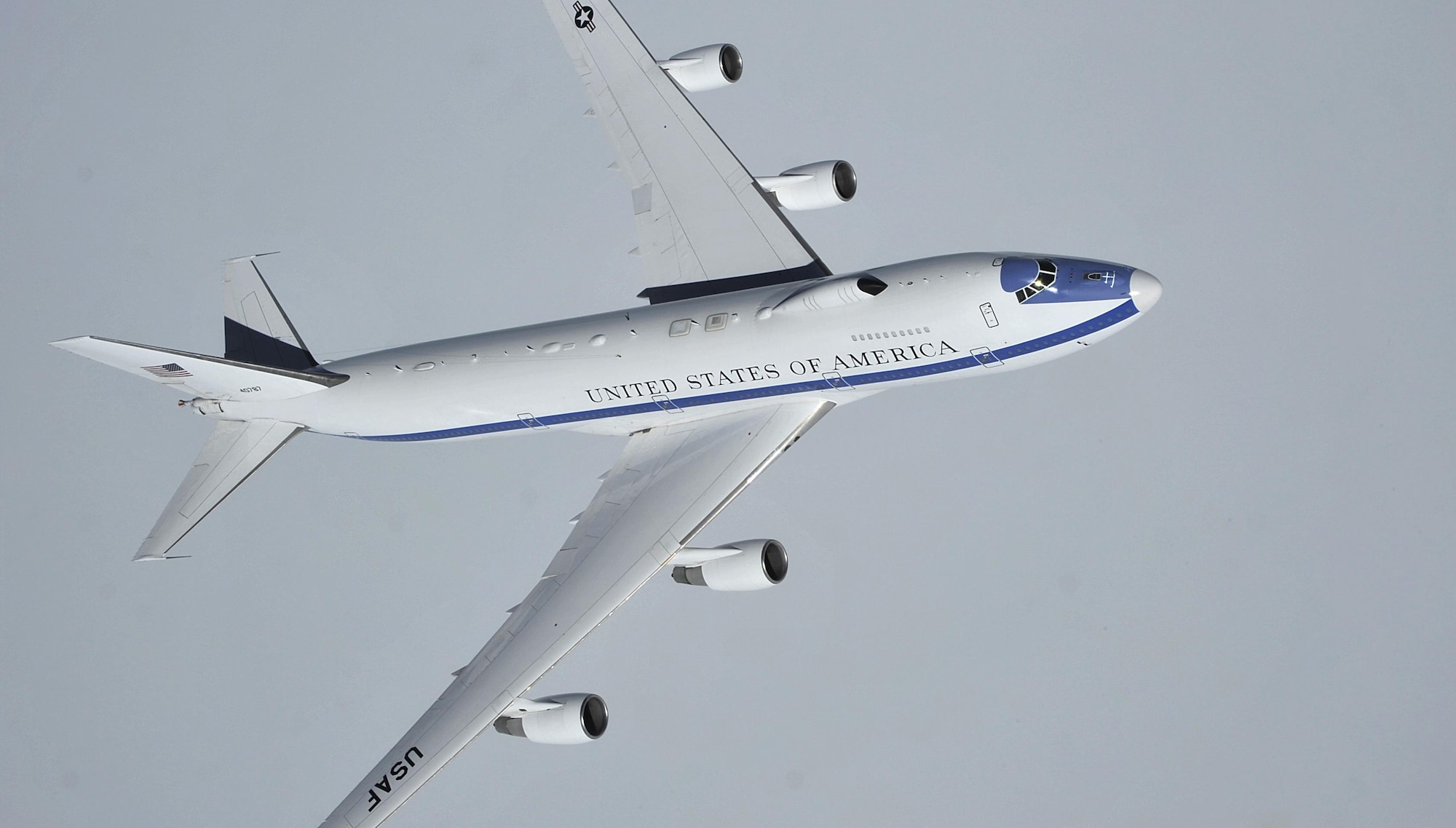 An Air Force E-4B flies over the Canadian Pacific coast, Wash., April 10, 2014. Air Combat Command is the Air Force single-resource manager for the E-4B, and provides aircrew, maintenance, security and communications support. E-4B operations are directed by the Joint Chiefs of Staff and executed through U.S. Strategic Command. (U.S. Air Force photo by Senior Airman Mary O'Dell)