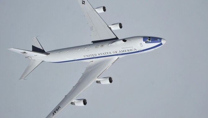 An Air Force E-4B flies over the Canadian Pacific coast, Wash., April 10, 2014. Air Combat Command is the Air Force single-resource manager for the E-4B, and provides aircrew, maintenance, security and communications support. E-4B operations are directed by the Joint Chiefs of Staff and executed through U.S. Strategic Command. (U.S. Air Force photo by Senior Airman Mary O'Dell)