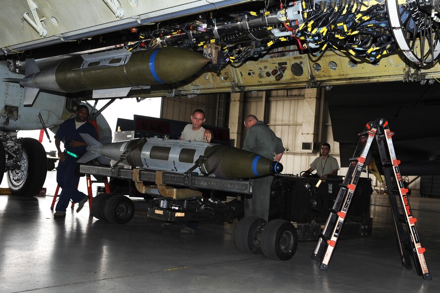 Airmen from the 5th Maintenance Group load standardization crew load JDAM bombs onto the conventional rotary launcher of the B-52H Stratofortress at Minot Air Force Base, N.D., Aug. 23, 2016. The crew members practice regularly to familiarize themselves with the loading process. (U.S. Air Force photo/Senior Airman Kristoffer Kaubisch)