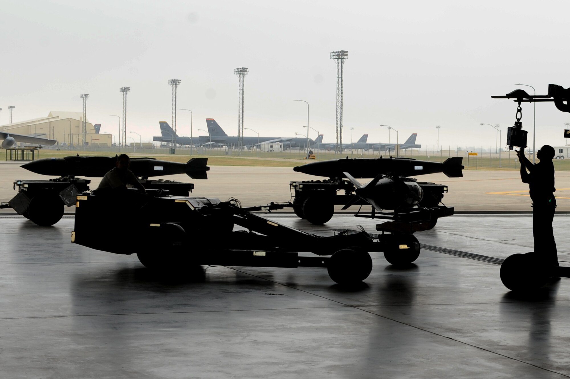 Airmen from the 5th Maintenance Group load standardization crew use a MHU-83 Jammer to load JDAM bombs onto the conventional rotary launcher of the B-52H Stratofortress at Minot Air Force Base, N.D., Aug. 23, 2016. The crew members practice regularly to familiarize themselves with the loading process. (U.S. Air Force photo/Senior Airman Kristoffer Kaubisch)