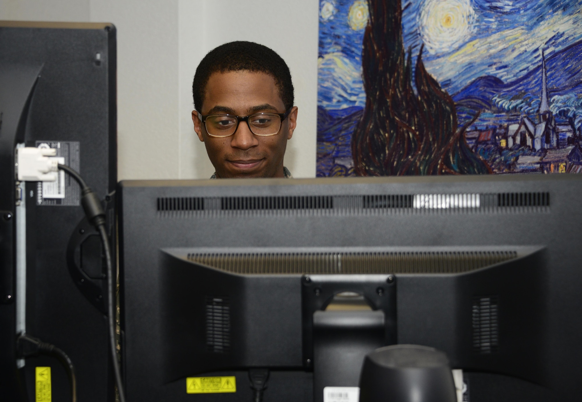 U.S. Air Force Staff Sgt. Marcus Jackson, 355th Communications Squadron network operations technician, runs a network security scan at Davis-Monthan Air Force Base, Ariz., Sept. 7, 2016. The network operations team is responsible for upgrading and ensuring all systems are compliant with the standards of the Defense Information Systems Agency by using software, hardware and scripting solutions. (U.S. Air Force photo by Senior Airman Betty R. Chevalier)