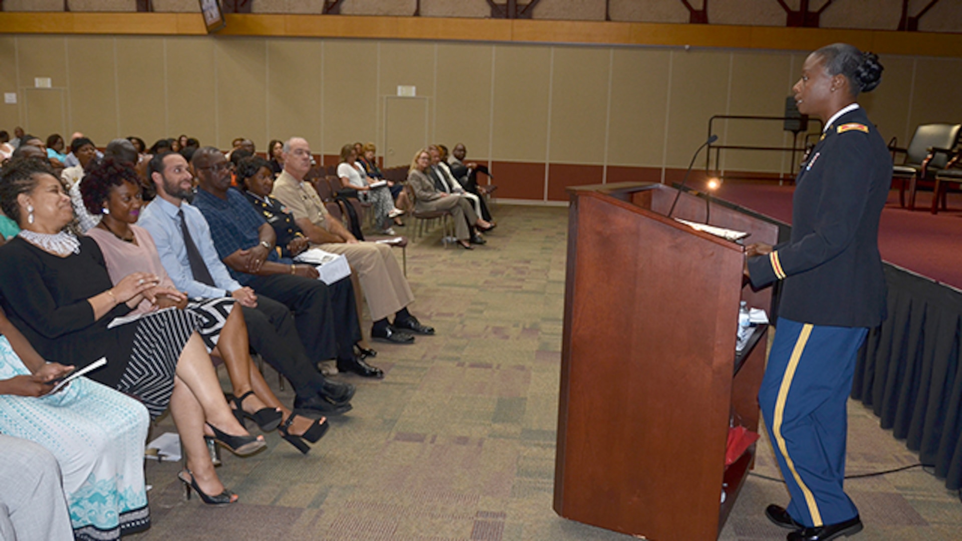 Defense Logistics Agency Aviation's Army Col. Kim Thomas, deputy director for Strategic Acquisition Programs Directorate speaks to Richmond employees during the Women's Equality Day celebration on Defense Supply Center Richmond, Virginia, August 31, 2016. Thomas is a decorated military leader with over 21 years of commissioned service and spoke on her career,  personal mentors and the importance of celebrating Women's Equality Day.