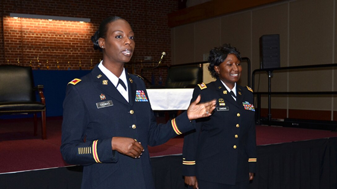 During the Women's Equality Day celebration on Defense Supply Center Richmond, Virginia, Aug. 31, 2016, Defense Logistics Agency Aviation's Army Col. Kim Thomas, deputy director for Strategic Acquisition Programs Directorate conducts a promotion ceremony for DLA Army Reserve Capt. Delecia Owens to Major. Owens is a contract specialist in Supplier Operations Commodities Directorate.