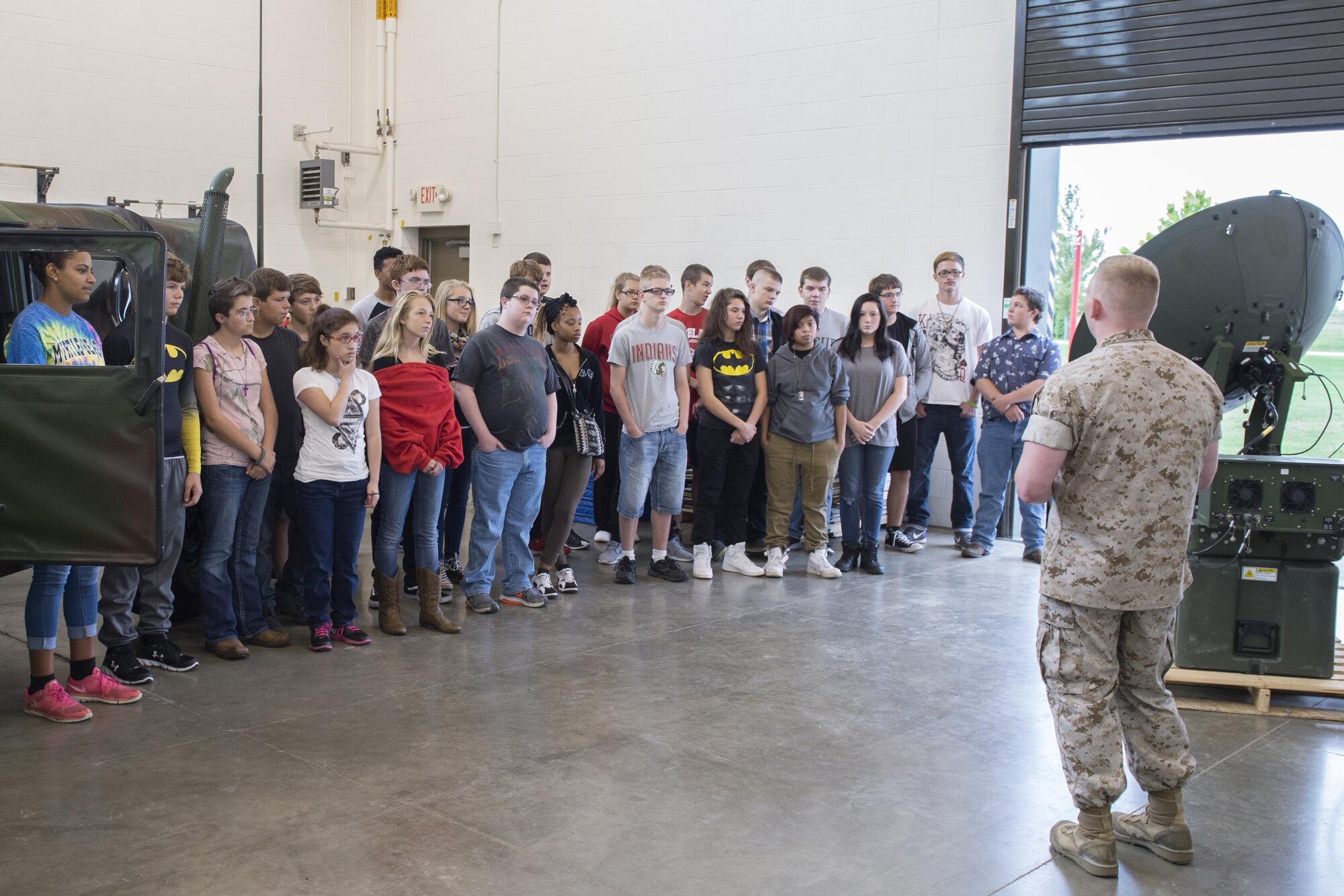 Marine Sgt. Trevor Williams, Detachment One, Communication Company, Combat Logistics Regiment 45, 4th Marine Logistics Group data chief, speaks to a group of Navy Junior ROTC cadets from Anderson High School during a tour of Grissom Air Reserve Base, Ind., Aug. 24, 2016. The tour was designed to give cadets a look at career fields from different military services to help cadets determine what they want to do after graduating high school.  (U.S. Air Force photo/Tech. Sgt. Benjamin Mota)