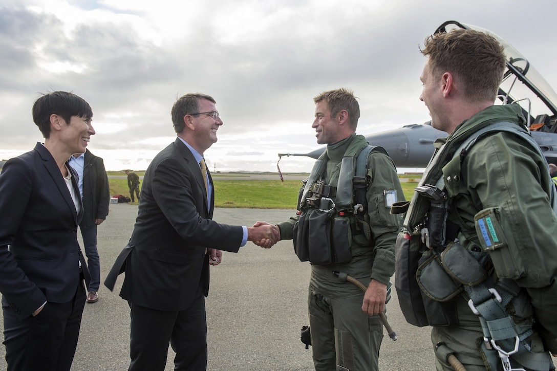 Defense Secretary Ash Carter, center left, and Norwegian Defense Minister Ine Eriksen Soreide thank the Norwegian F-16 Fighting Falcon pilots who escorted their aircraft after arriving at Bodo Air Base, Norway, Sept. 8, 2016. DoD photo by Air Force Tech. Sgt. Brigitte N. Brantley