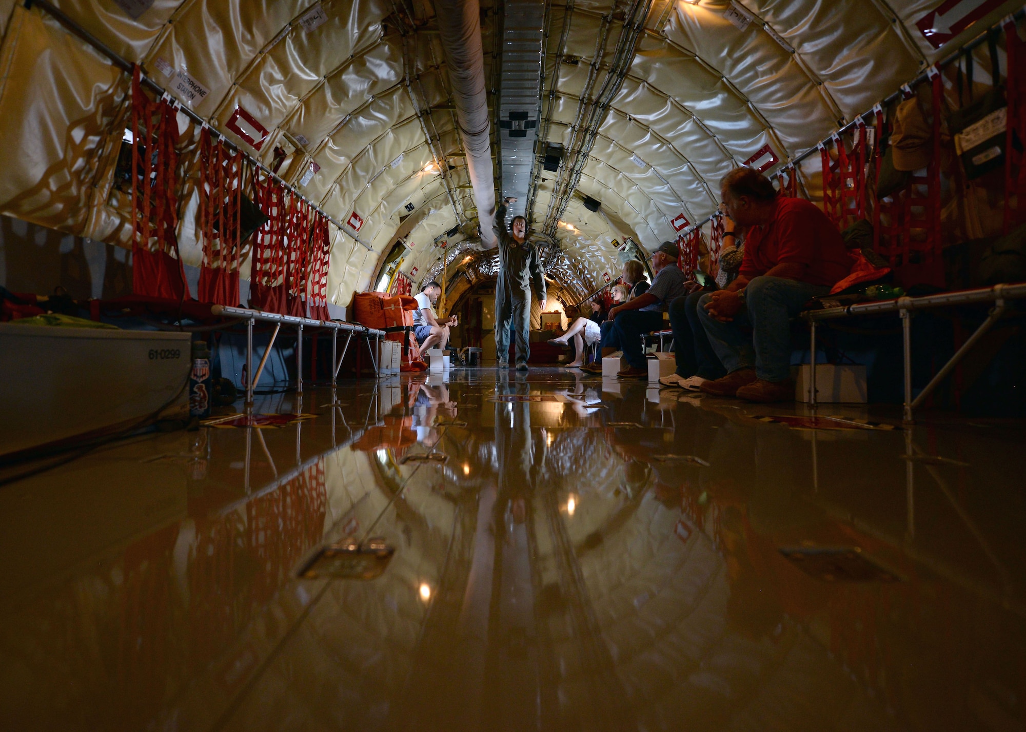 U.S. Air Force Staff Sgt. Mark Waski, 54th Air Refueling Squadron instructor boom operator, makes his way down the KC-135 Stratotanker to help control the boom in order to refuel a C-17 Globemaster III over Texas, Aug. 31, 2016.This was the 60th anniversary flight of the KC-135 that has provided long-range aerial refueling support for Air Force, Navy, Marine Corps and allied aircraft for years.