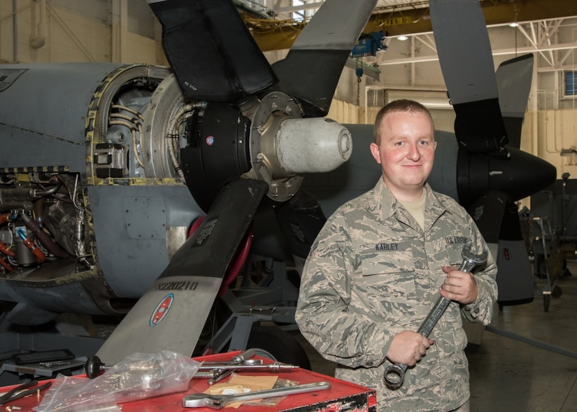 Air Force Airman 1st Class John Karley, 136th Maintenance Squadron propulsion technician, Texas Air National Guard, pauses from repairing a propulsion system to take a photo at Naval Air Station Fort Worth Joint Reserve Base, Texas, Aug. 27, 2016. Karley recently returned from an overseas trip with his unit. Air National Guard photo by Senior Master Sgt. Elizabeth Gilbert