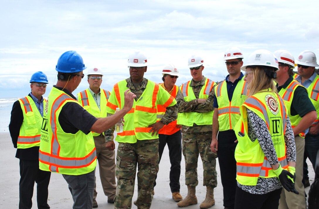 Brig. Gen.  David C. Turner (fourth from left), South Atlantic Division commander, receives a Duval County Shore Protection Project briefing at Jacksonville Beach.  About 650,000 cubic yards of sand will get pumped onto seven miles of eroded beaches, including Jacksonville, Neptune and a portion of Atlantic Beach.  Turner toured several area projects a day prior to Hurricane Hermine striking Florida Sept. 1.  