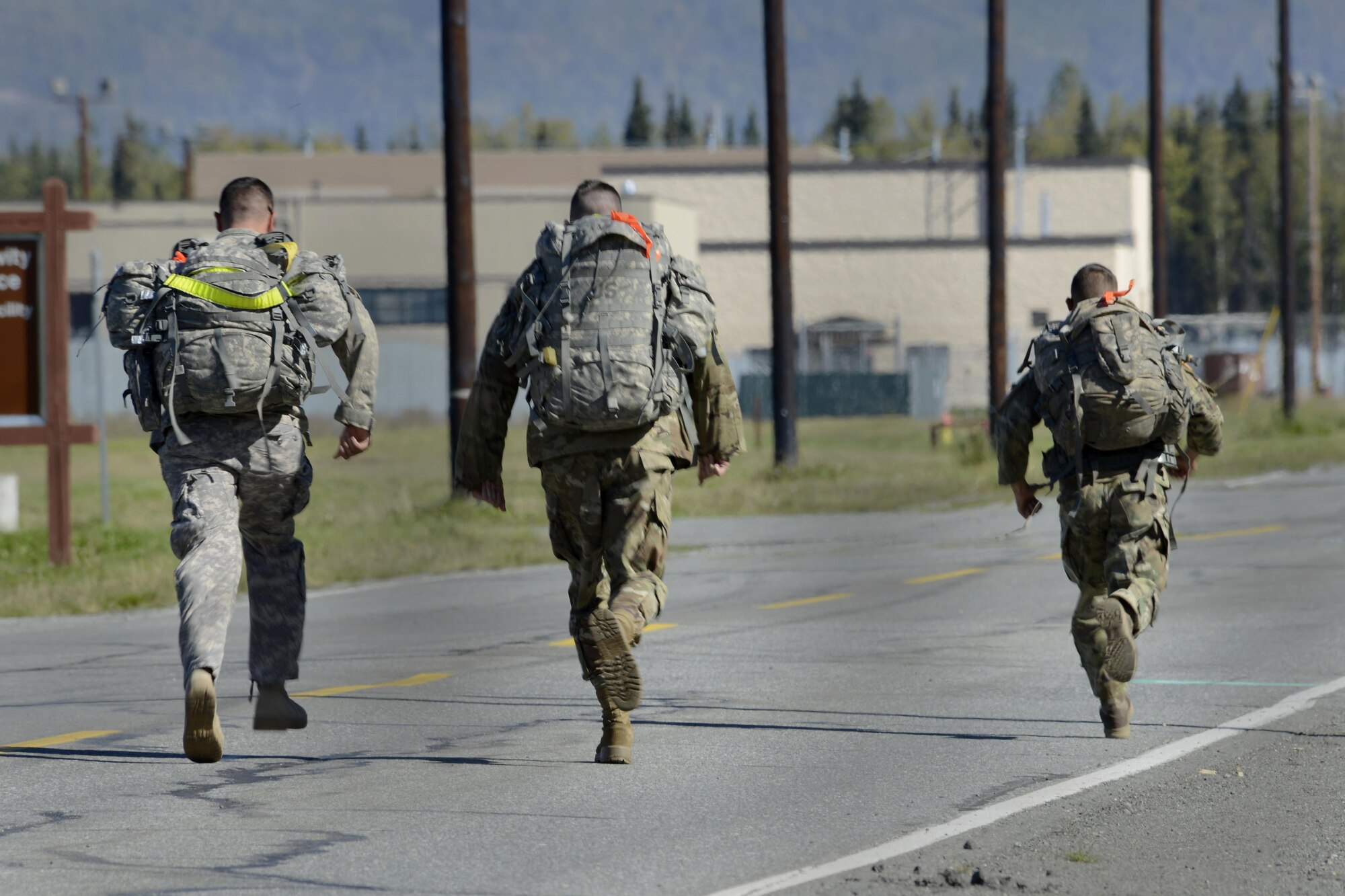 Soldiers assigned to U.S. Army Alaska compete in the Combat Cross-Country Series 10-Mile Relay on the Davis Highway, Sept. 1, 2016. The relay consisted of five-man teams in Army Combat Uniforms and combat boots racing for the best time with 35-pound rucksacks. 