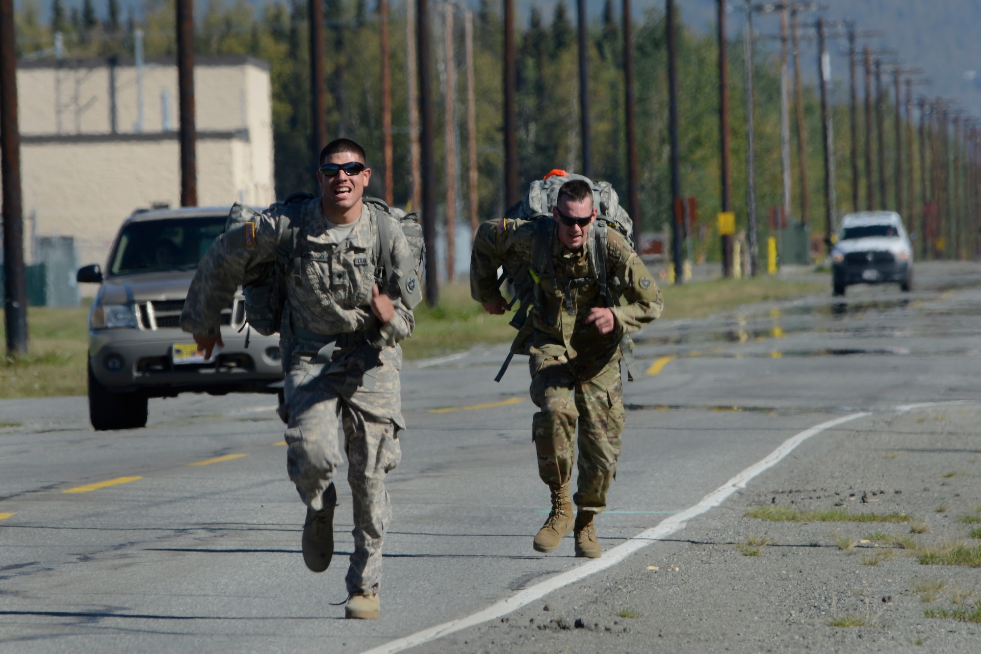 Soldiers assigned to the 98th Support Maintenance Company, 17th Combat Sustainment Support Battalion, U.S. Army Alaska, compete in the Combat Cross-Country Series 10-Mile Relay on the Davis Highway, Sept. 1, 2016. The relay consisted of five-man teams in Army Combat Uniforms and combat boots racing for the best time with 35-pound rucksacks. 