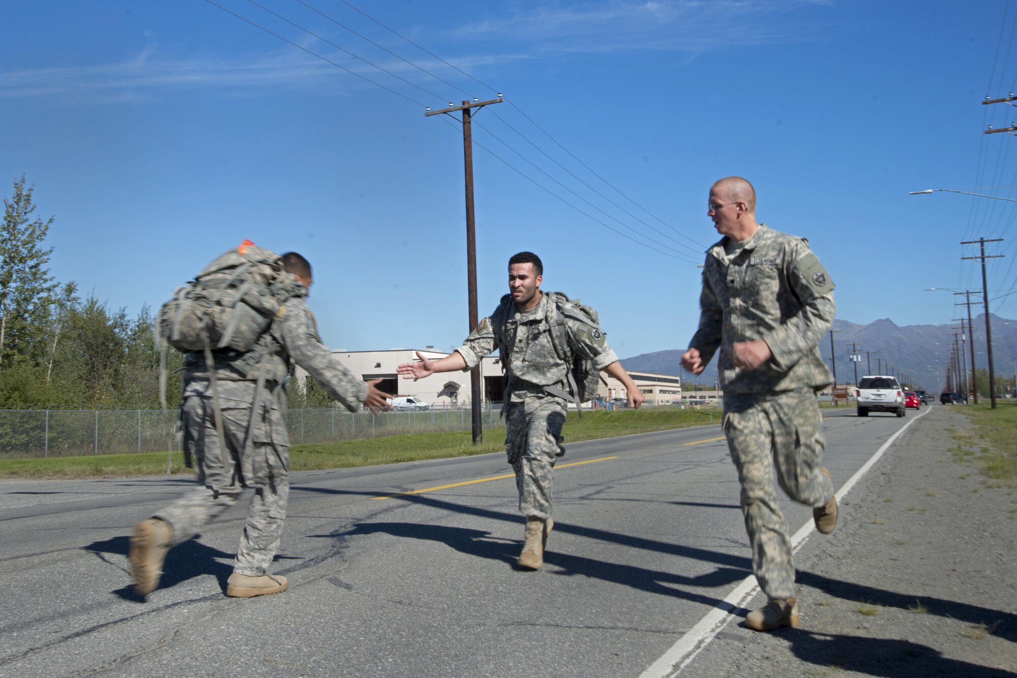 Soldiers assigned to the 98th Support Maintenance Company, 17th Combat Sustainment Support Battalion, U.S. Army Alaska, compete in the Combat Cross-Country Series 10-Mile Relay on the Davis Highway, Sept. 1, 2016. The relay consisted of five-man teams in Army Combat Uniforms and combat boots racing for the best time with 35-pound rucksacks.
