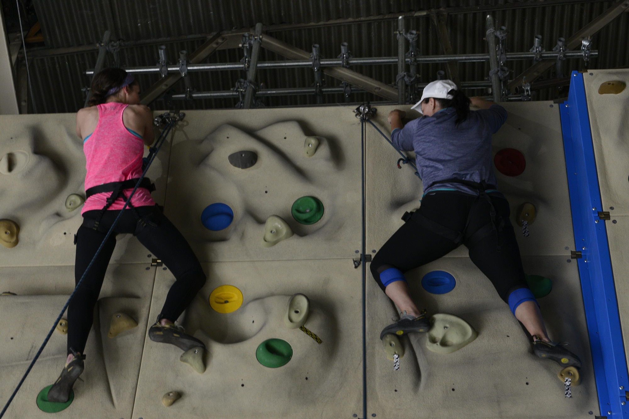 Paige Wyse, left, and Steph Mcginty, right, reach the top of a rock wall during an introduction to climbing and belay class at the Joint Base Elmendorf-Richardson Outdoor Recreation Center, Sept. 1, 2016. The class was part of the Women in the Wilderness program which offers many introductory classes such as camping, fishing, kayaking and hiking.