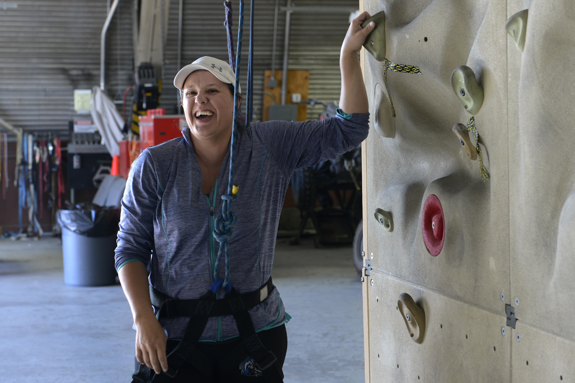 Steph Mcginty prepares to climb a rock wall an introduction to climbing and belay class at the Joint Base Elmendorf-Richardson Outdoor Recreation Center, Sept. 1, 2016. The class is part of the Women in the Wilderness program which helps women feel more confident in their skills outdoors.