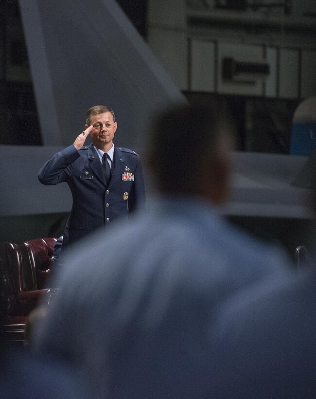 Col. Bradley McDonald renders his first salute as commander of the 88th Air Base Wing at the end of his change of command ceremony at the National Museum of the U.S. Air Force on Wright-Patterson Air Force Base, Ohio, June 21, 2016. Before assuming command of the 88th ABW, McDonald served as the 10th ABW vice commander at the U.S. Air Force Academy, Colorado. (U.S. Air Force photo / R.J. Oriez)