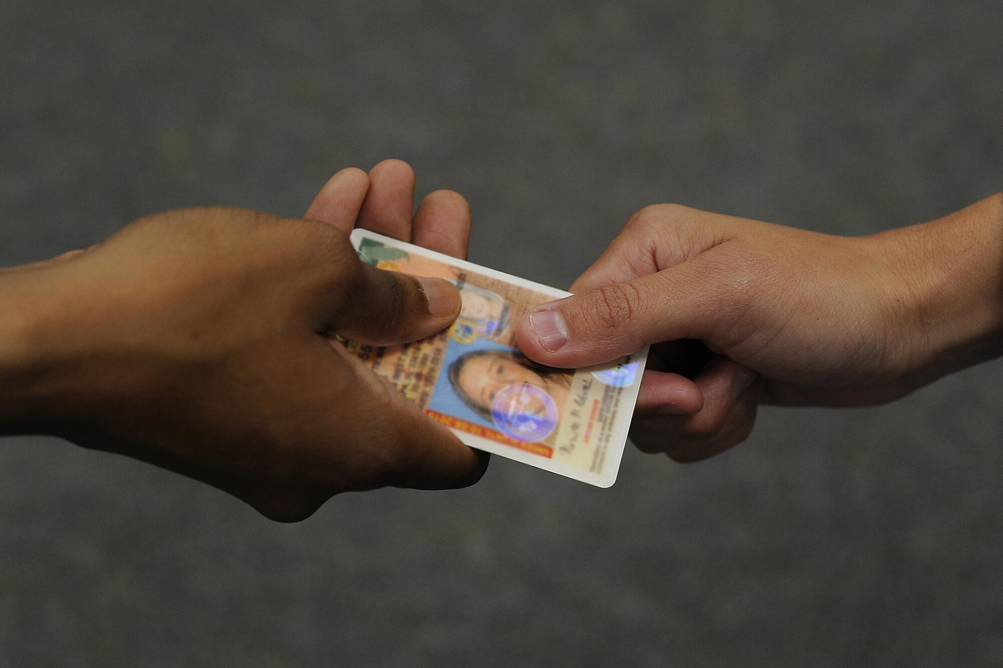 Beginning Sept. 15, 2016, MacDill Air Force Base, Florida, will not accept forms of identification from non-compliant REAL ID Act states and territories. Individuals with non-compliant IDs will be required to provide an alternative form of identification. (U.S. Air Force photo by Airman 1st Class Mariette Adams)