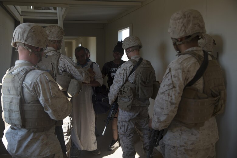 Marines with Special Purpose Marine Air Ground Task Force, Crisis Response, Central Command, conduct a non-combatant evacuation operation exercise at Range 220, a military operations on urbanized terrain facility, aboard the Marine Corps Air Ground Combat Center, Twentynine Palms, Calif., Aug. 24, as part of a Certification Exercise. (Official Marine Corps photo by Lance Cpl. Levi Schultz/Released)