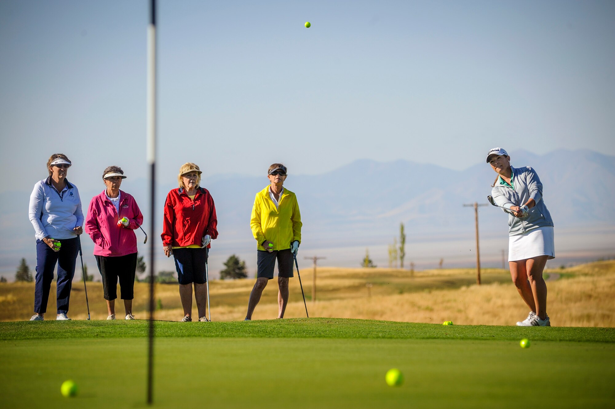 LPGA touring professional Kim Hall demonstrates chipping technique to golf expo attendees at the Hubbard Memorial Golf Course, Sept. 5, 2016. Hall and fellow LPGA golfer Mallory Blackwelder provided tips and drills to help the Hill Air Force Base golfing community improve their putting, chipping, and driving skills. (U.S. Air Force photo by Paul Holcomb) 