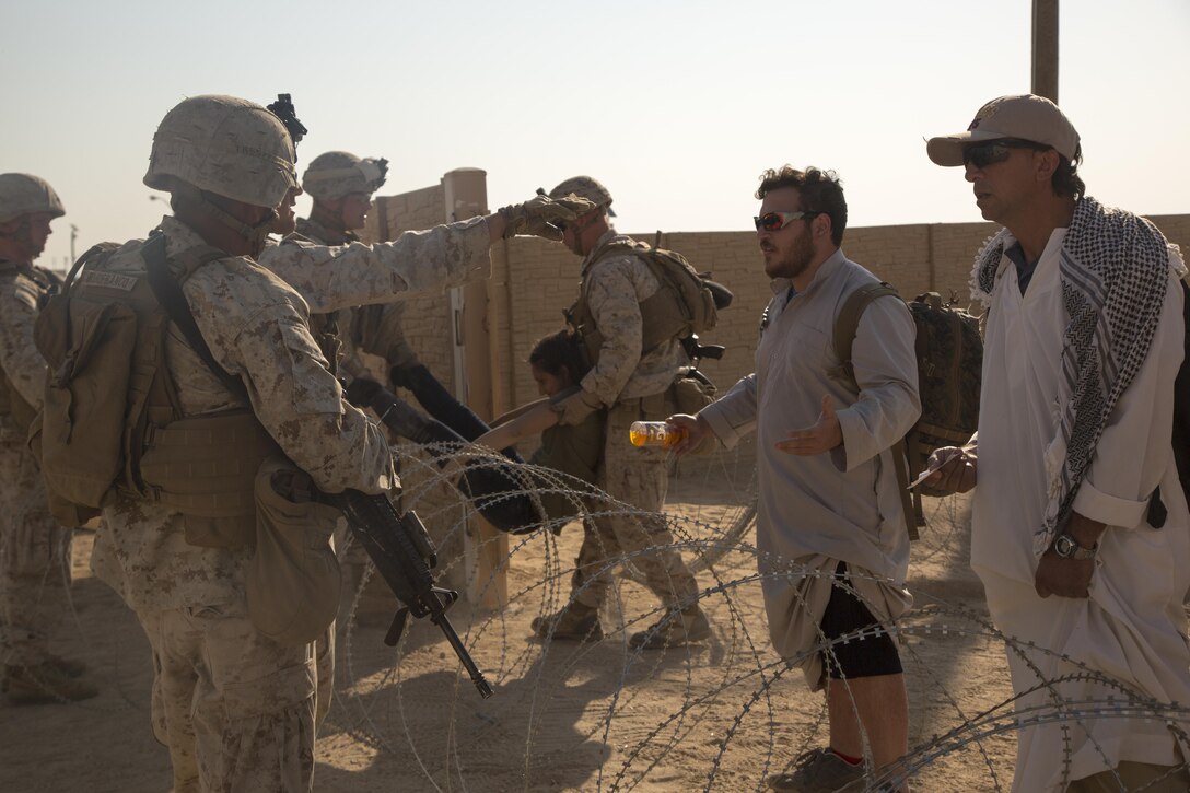 Marines with Special Purpose Marine Air Ground Task Force, Crisis Response, Central Command, conduct a non-combatant evacuation operation exercise at Range 220, a military operations on urbanized terrain facility, aboard the Marine Corps Air Ground Combat Center, Twentynine Palms, Calif., Aug. 24, as part of a Certification Exercise. (Official Marine Corps photo by Lance Cpl. Levi Schultz/Released)