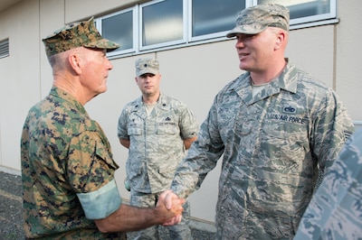 Marine Corps Gen. Joe Dunford, chairman of the Joint Chiefs of Staff, recognizes Air Force Tech Sgt. Garrett Oneto