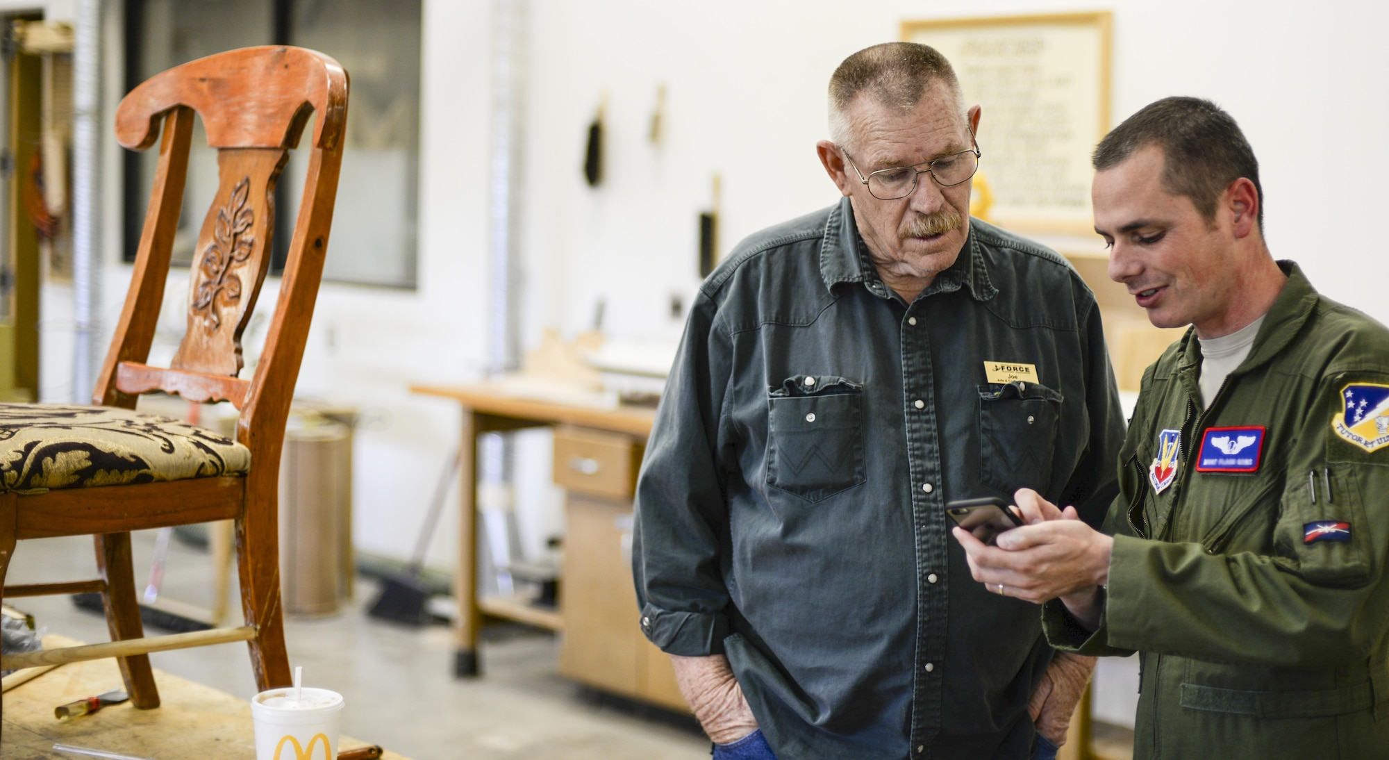 Master Sgt. Joshua, the 9th Attack Squadron superintendent, gets advice from Joe, the 49th Force Support Squadron Wood Shop supervisor, on an upcoming project at Holloman Air Force Base, N.N. 9 Aug. 2016. The Wood Shop is open every Tuesday and Thursday afternoon from 3-6 p.m. (Last names are being withheld due to operational requirements. U.S. Air Force photo by Airman Alexis P. Docherty) 