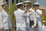Rear Adm. Bill Byrne, commander, U.S. Naval Forces Korea (CNFK) is awarded the Republic of Korea (ROK) Order of National Security Merit Cheonsu Medal by ROK Chief of Naval Operations Jung, Ho-sub during a change of command ceremony for CNFK, Sept. 8, 2016. During the ceremony, Rear Adm. Brad Cooper became the 35th commander of CNFK after relieving Byrne. 