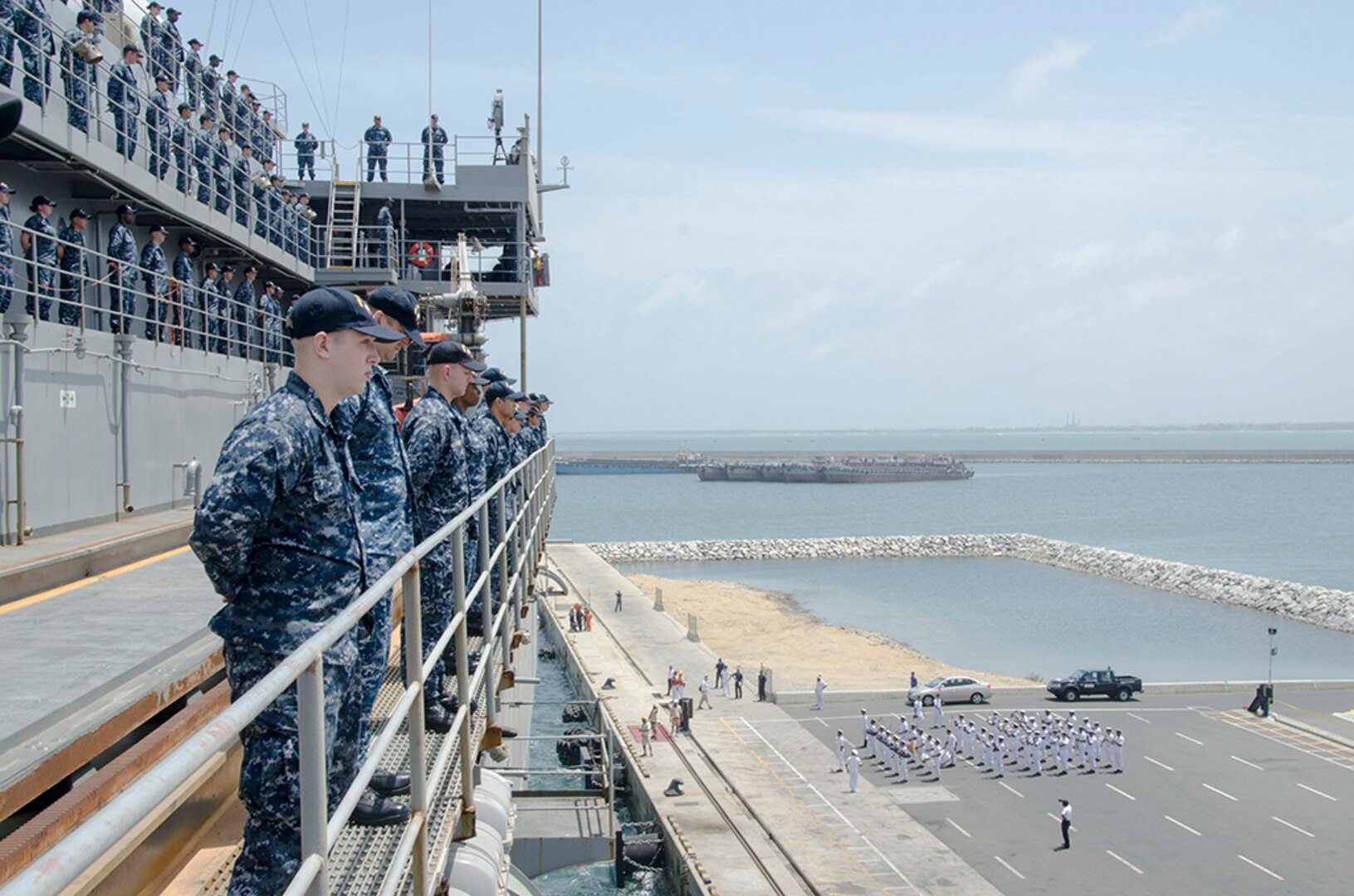Sailors assigned to the submarine tender USS Frank Cable (AS 40), man the rails while pulling into Colombo, Sri Lanka. The visit is aimed at building friendship and goodwill between the U.S. and the people of Sri Lanka, Aug. 29, 2016. Frank Cable is one of two forward-deployed submarine tenders and is on a scheduled deployment in the U.S. 7th Fleet area of operations to conduct maintenance and support of deployed U.S. naval force submarines and surface vessels in the Indo-Asia-Pacific region. 