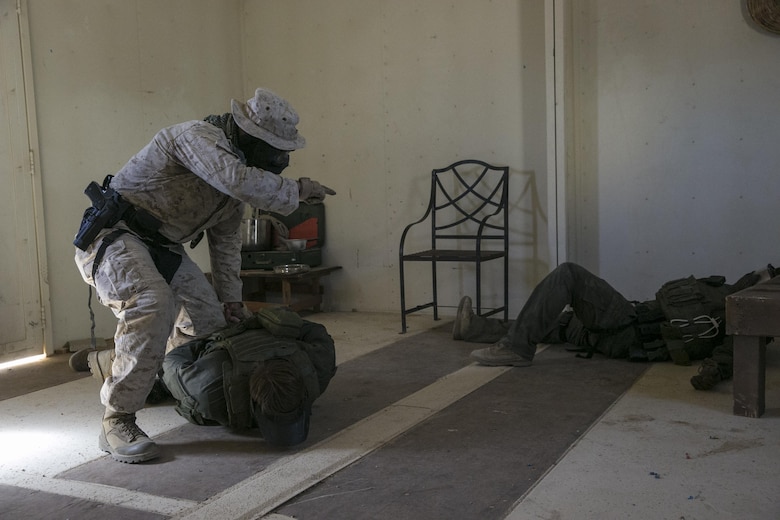 Sgt. Timothy Hodapp, military police officer, Provost Marshal’s Office, detains role players during an escalation of force exercise at Range 800 aboard Marine Corps Air Ground Combat Center, Twentynine Palms, Calif., Aug. 30, 2016. PMO uses these drills to prepare for scenarios they could potentially encounter while out on patrol. (Official Marine Corps photo by Lance Cpl. Dave Flores/Released)