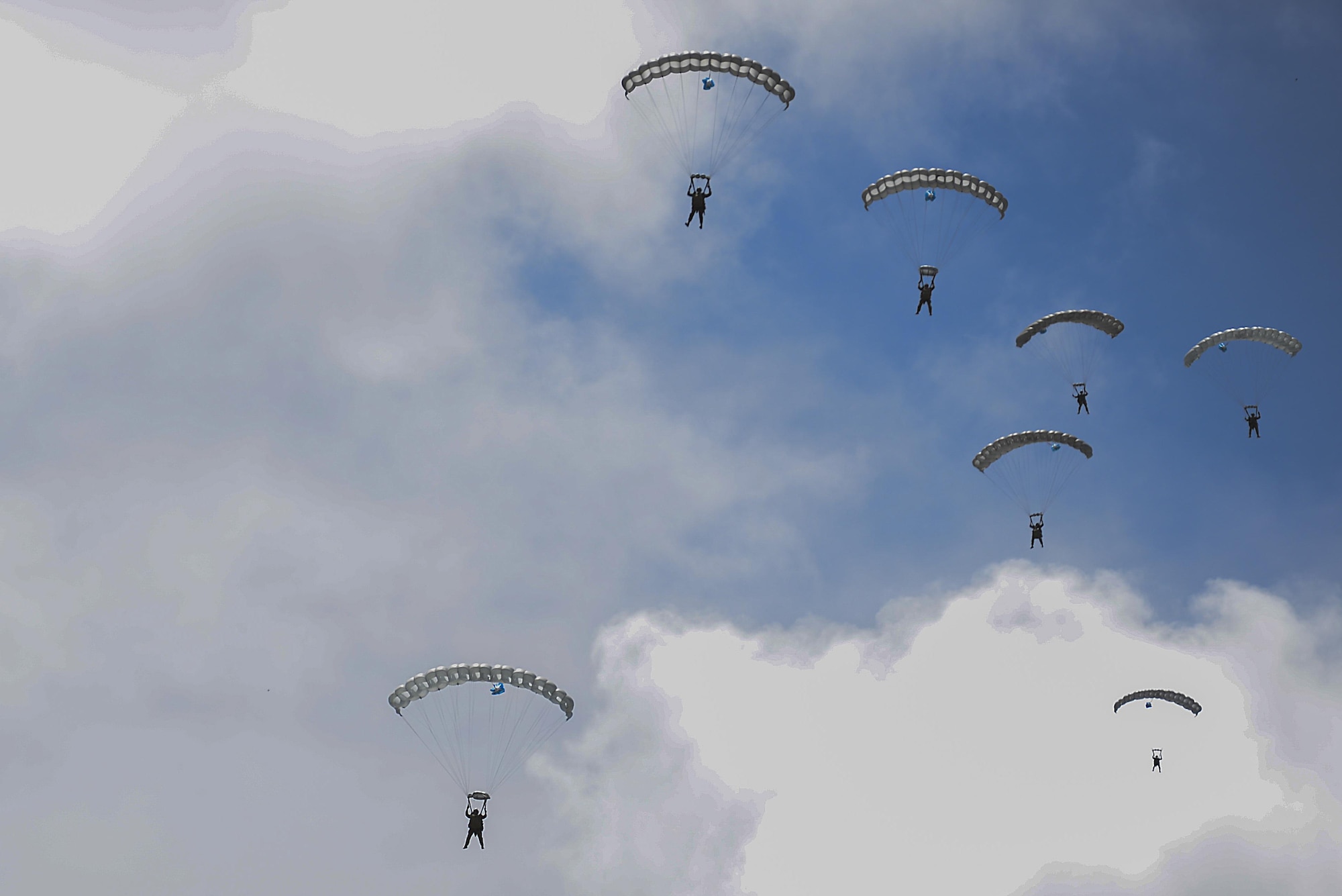 Members of the III Marine Expeditionary Force, 31st Marine Expeditionary Unit, Force Reconnaissance Platoon, jump from a 17th Special Operations Squadron MC-130J Commando II during an airfield seizure exercise Aug. 24, at Wake Island. Jump Clearing Teams conducted this training to build interoperability between the two units and ensure when the time comes the two forces are able to execute a joint mission as smoothly as possible. (U.S. Air Force photo by Senior Airmen Stephen G. Eigel)