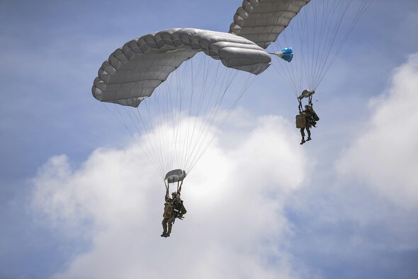 Marines jump from an MC-130J Commando II during an airfield seizure exercise at Wake Island Aug. 24, 2016. The training allowed the units to address any issues before taking on any real world tasking. (U.S. Air Force photo/Senior Airmen Stephen G. Eigel)