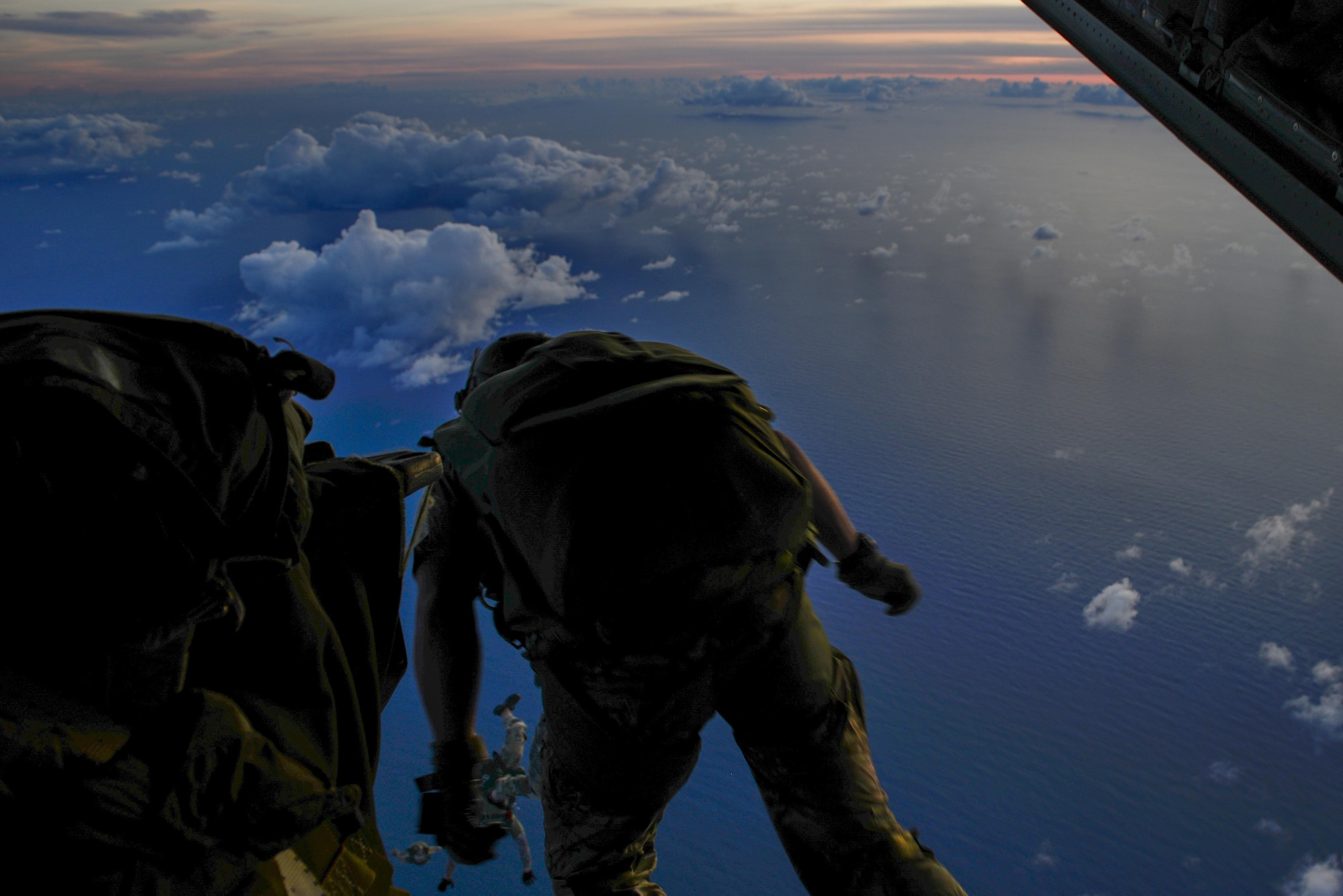 A 320th Special Tactics Squadron member, jumps from an MC-130J Commando II from the 17th Special Operations Squadron during an airfield seizure exercise Aug. 24, at Wake Island. The realistic training of the operations conducted allowed the units to address any issues before taking on any real world tasking. (U.S. Air Force photo by Senior Airmen Stephen G. Eigel)