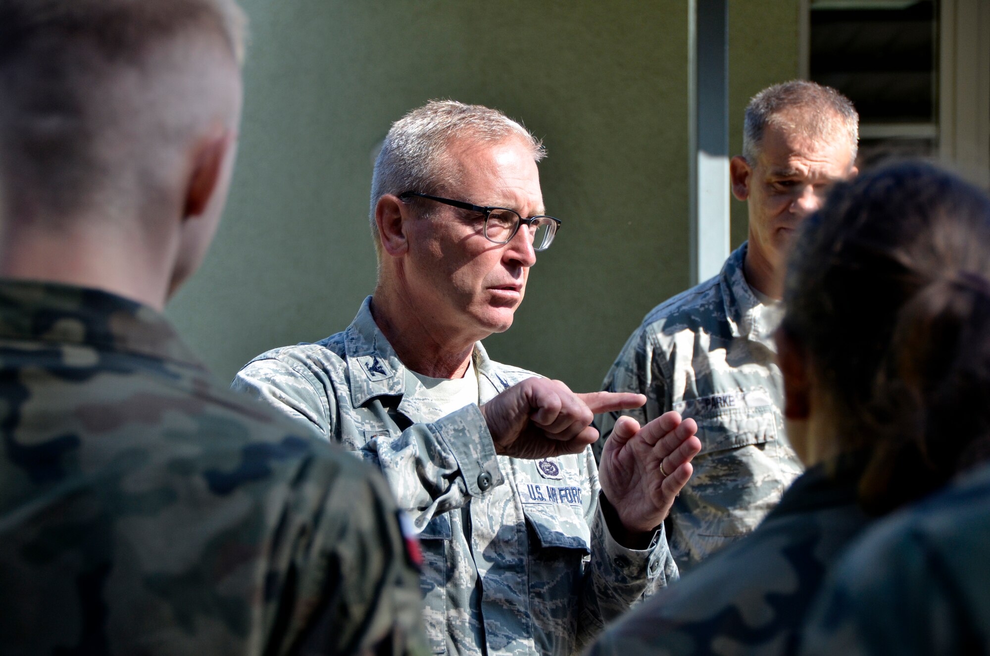 Lask Air Base, Poland -- Col. Joel DeGroot, 114th Maintenance Group commander, speaks with Polish maintenance officer cadets here, Sept. 6. Fifteen cadets had the opportunity to visit with members of the 114th Maintenance Group and ask questions about U.S. processes. (U.S. Air National Guard photo by Capt. Amy Rittberger/Released)