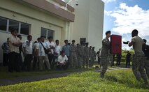 Members of the Kadena Police Station and the Okinawa Police Station observe oleoresin capsicum spray training conducted by the 18th Security Forces Squadron Sept. 2, 2016, at Kadena Air Base, Japan. Local police officers had the opportunity to observe the operations of the 18th SFS during an open house event. (U.S. Air Force photo by Senior Airman Lynette M. Rolen)